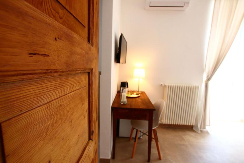 Televízia a/alebo spoločenská miestnosť v ubytovaní San Michele Luxury Rooms