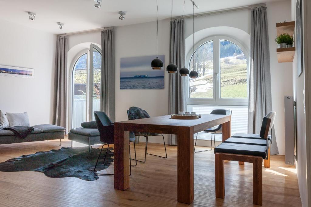 a living room with a dining room table and chairs at Chalet-Pfronten in Pfronten