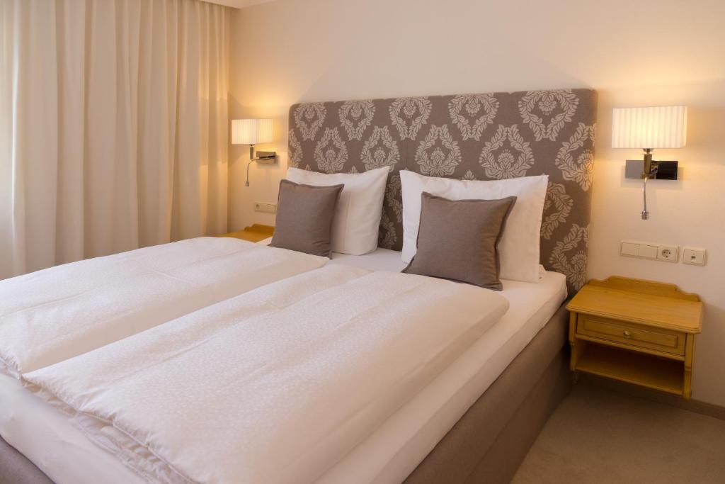 Postel nebo postele na pokoji v ubytování Hotel Arabell
