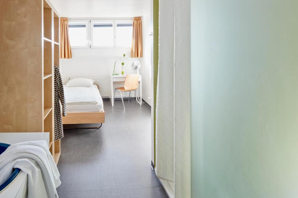 Voodi või voodid majutusasutuse Ostello Montebello - Bellinzona Youth Hostel toas
