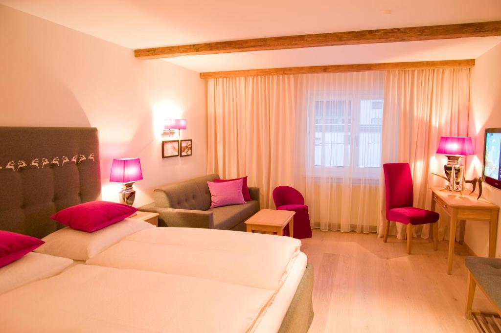 Postel nebo postele na pokoji v ubytování Hotel Arabell