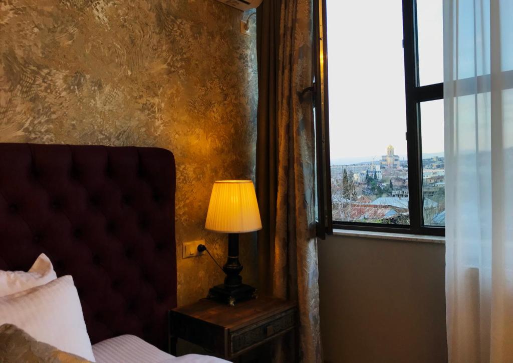 Postel nebo postele na pokoji v ubytování Omart Hotel - Gallery