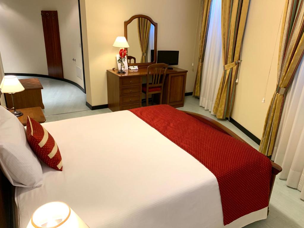 Postel nebo postele na pokoji v ubytování Albergo Italia