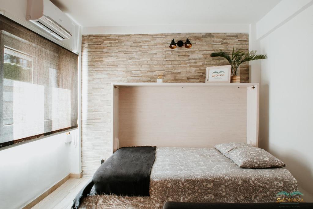 Cama o camas de una habitación en Sol Ohana Apartamento Boutique