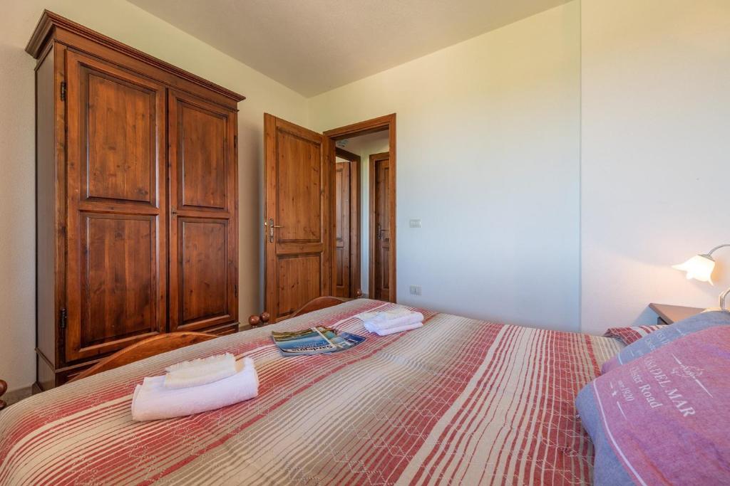 A bed or beds in a room at House and Apts. Siniscola/Sardinien 35758