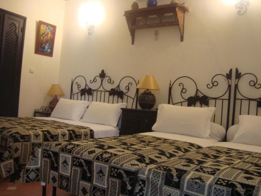 Letto o letti in una camera di Riad Jnane Mogador