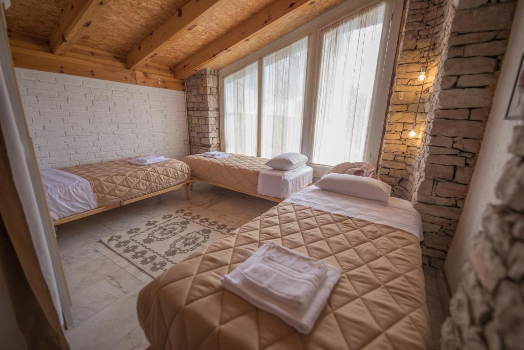 Letto o letti in una camera di Mosaic Home