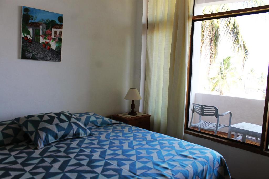 Postel nebo postele na pokoji v ubytování Posada del Mar