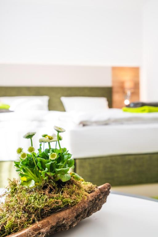 Postel nebo postele na pokoji v ubytování Hotel-Pension Treppengasse Nr 6