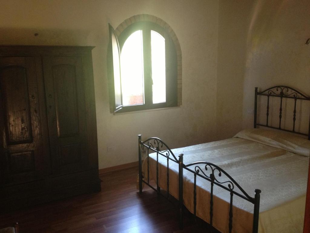 Postel nebo postele na pokoji v ubytování Agriturismo L'Antico Casale