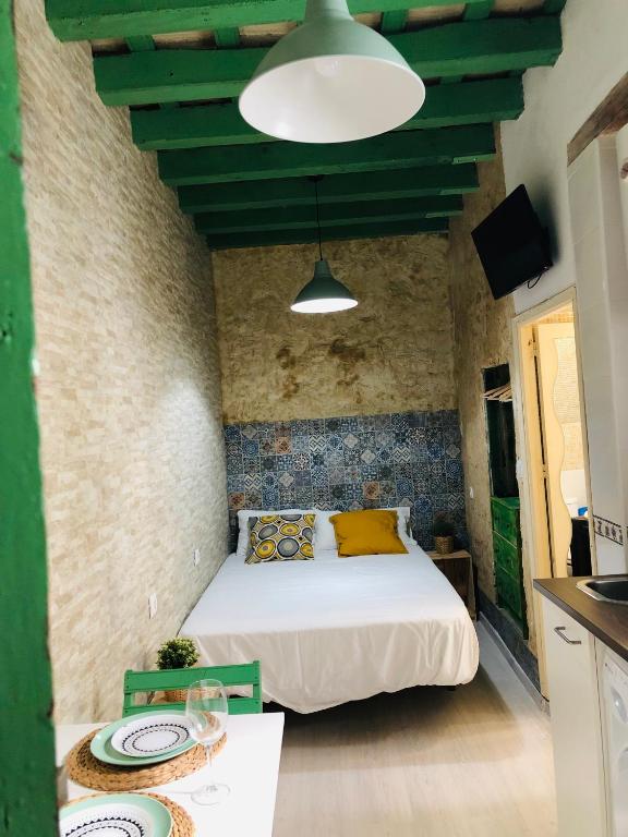 Posteľ alebo postele v izbe v ubytovaní Conil Homes III Apartments