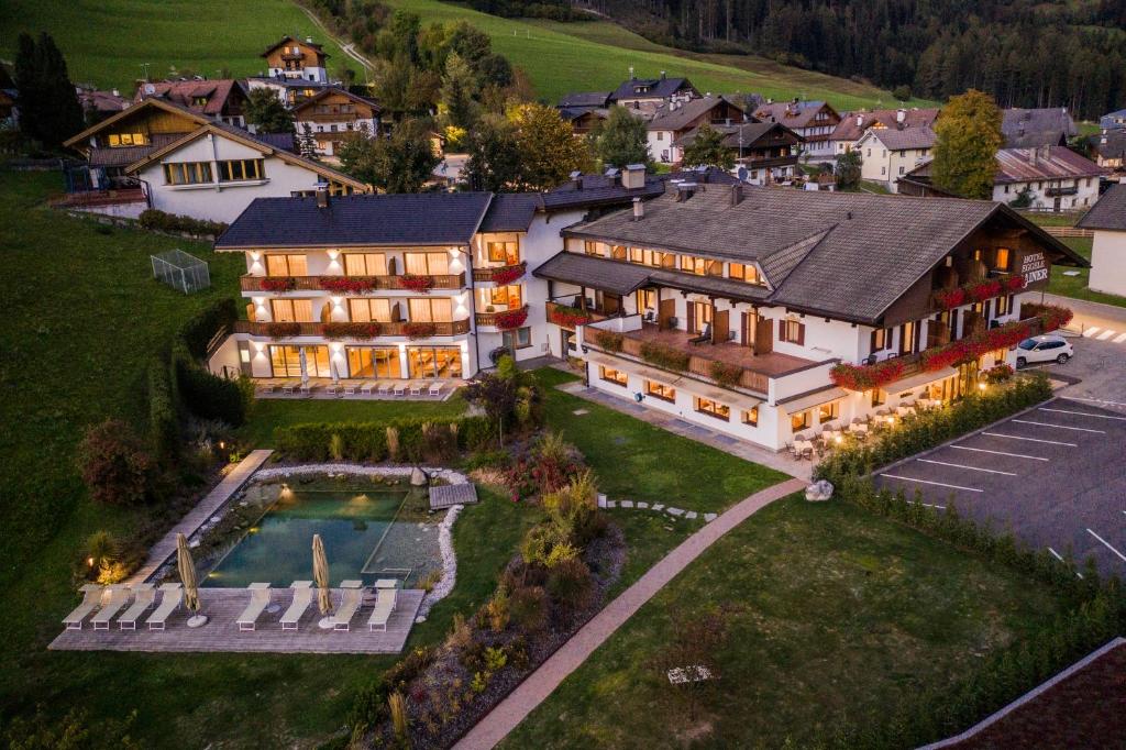 an aerial view of a house with a swimming pool at Boutique Hotel Eggele in San Candido