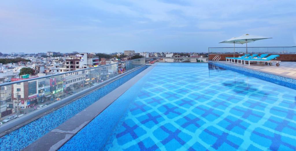 a large swimming pool on the roof of a building at Golden Premier Amritsar in Amritsar