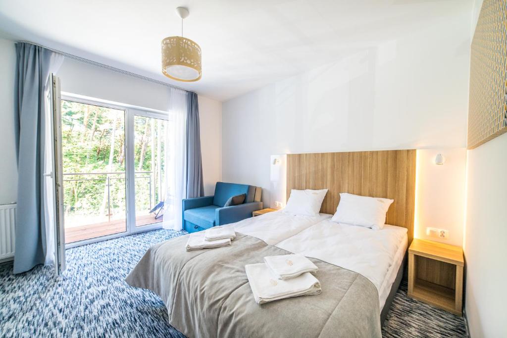 Postel nebo postele na pokoji v ubytování WYDMA Resort Medi & SPA - Normobaria