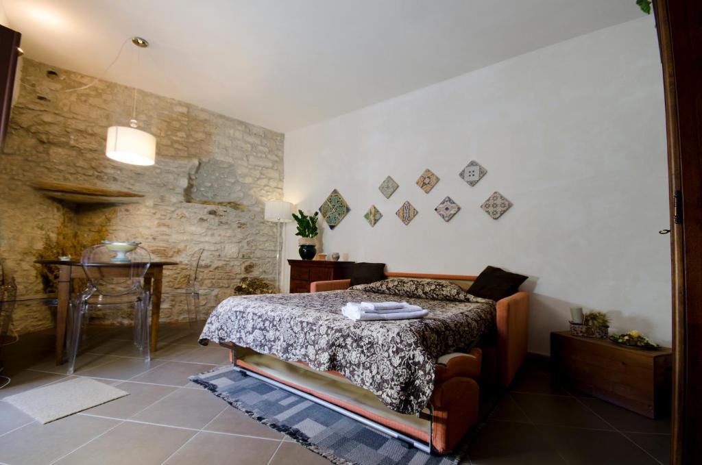 Posteľ alebo postele v izbe v ubytovaní Residence Erice Pietre Antiche