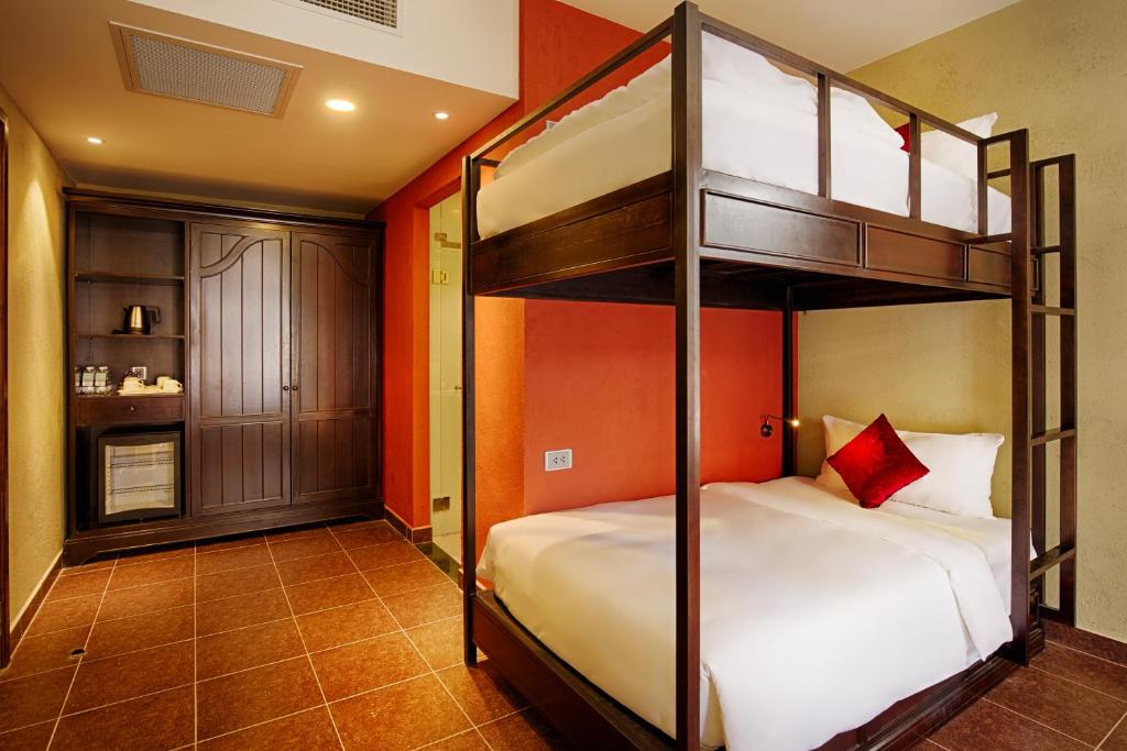 Family Deluxe Room with One King Bed and One Single Bed