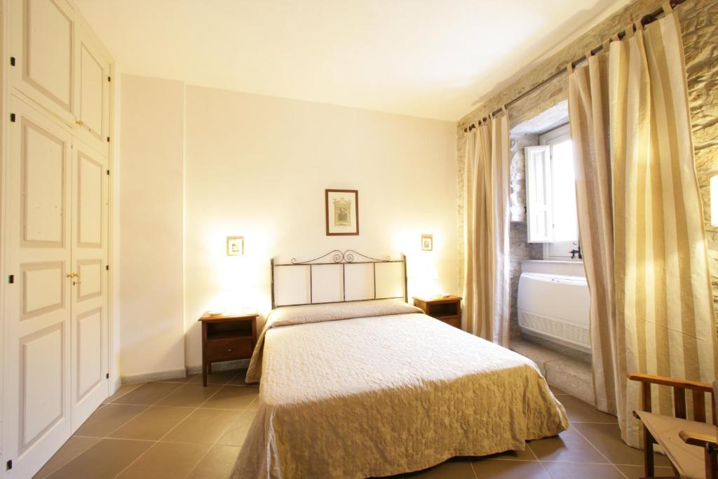 Posteľ alebo postele v izbe v ubytovaní Residence Erice Pietre Antiche