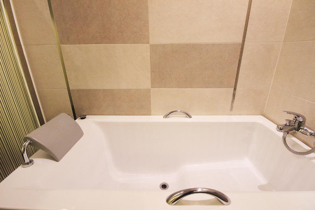 Koupelna v ubytování H Drive Hotel