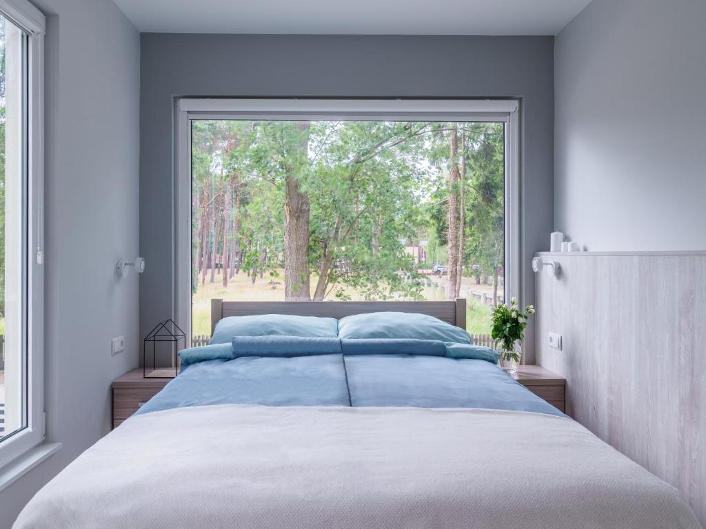 Postel nebo postele na pokoji v ubytování Parkova Apartamenty