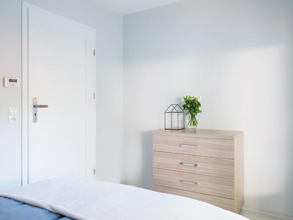 Postel nebo postele na pokoji v ubytování Parkova Apartamenty