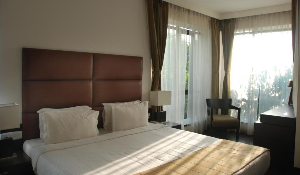 Postel nebo postele na pokoji v ubytování Hotel Metropole