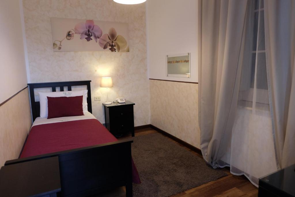 Postel nebo postele na pokoji v ubytování Hotel Villa Nettuno