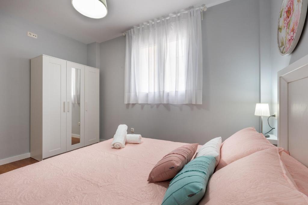Posteľ alebo postele v izbe v ubytovaní Premium Mediterraneo Beach, Malaga Apartamento junto a la playa