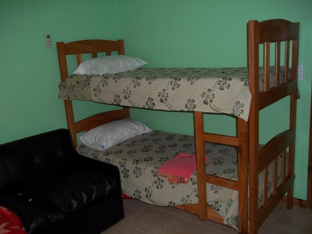 Postel nebo postele na pokoji v ubytování Cabañas El Hornero