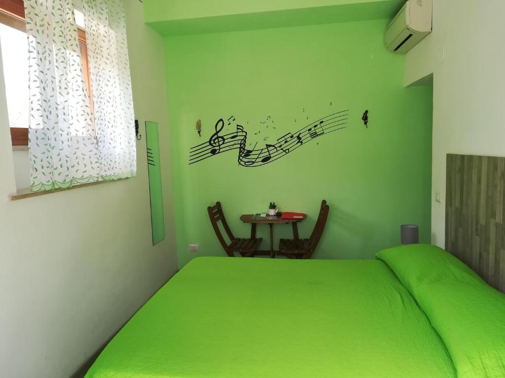 Postel nebo postele na pokoji v ubytování Sorrento Experience