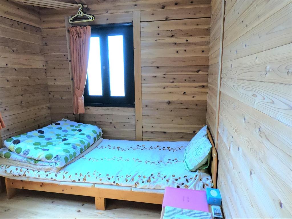 Postel nebo postele na pokoji v ubytování Koinami