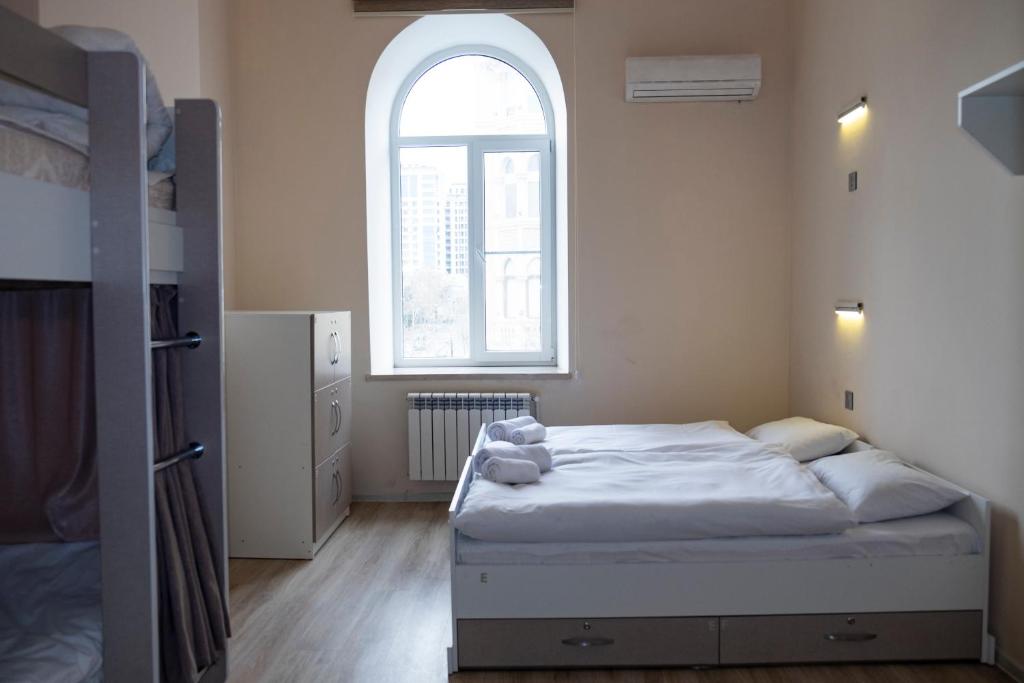 Postel nebo postele na pokoji v ubytování Travel Inn Hostel