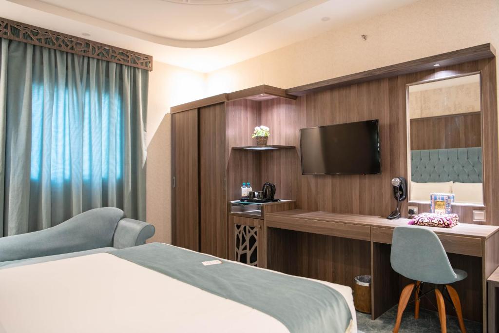 Postel nebo postele na pokoji v ubytování Viola Hotel
