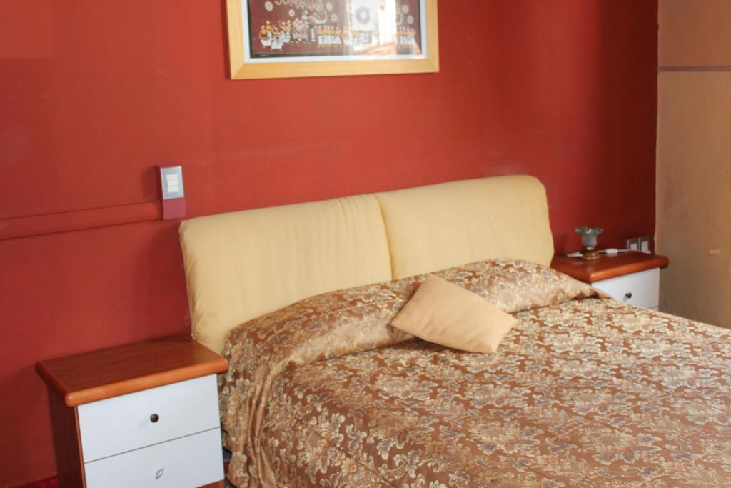 Postel nebo postele na pokoji v ubytování Hotel San Lorenzo