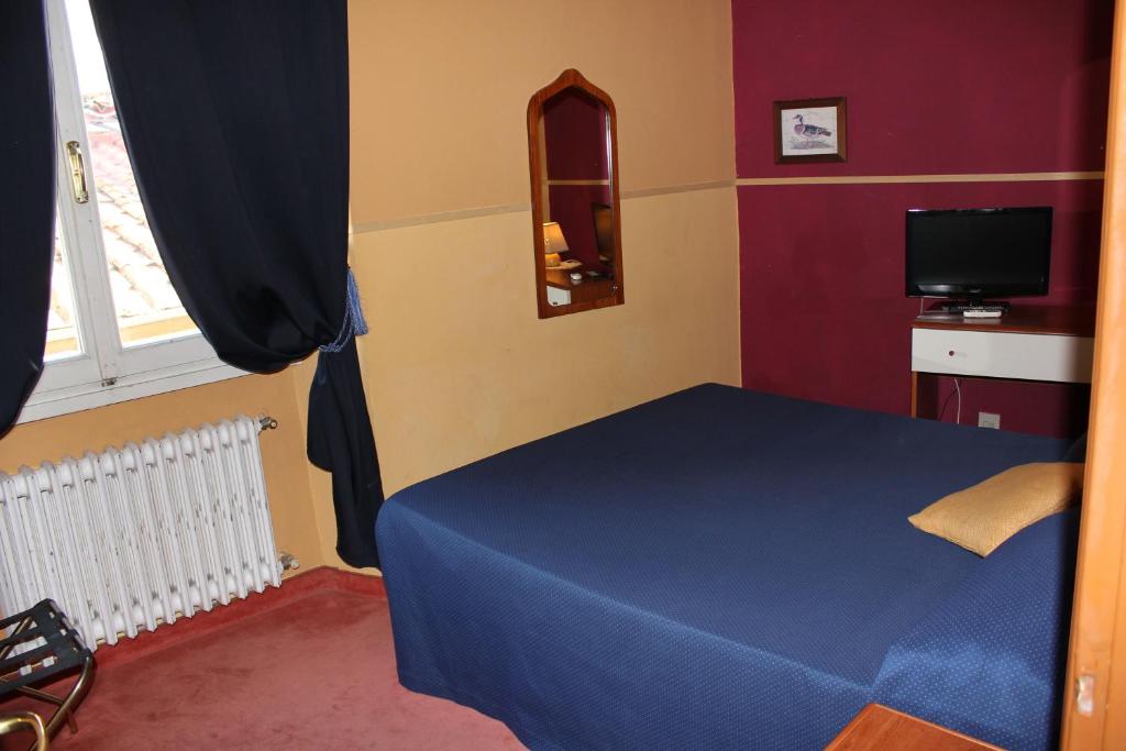 Postel nebo postele na pokoji v ubytování Hotel San Lorenzo