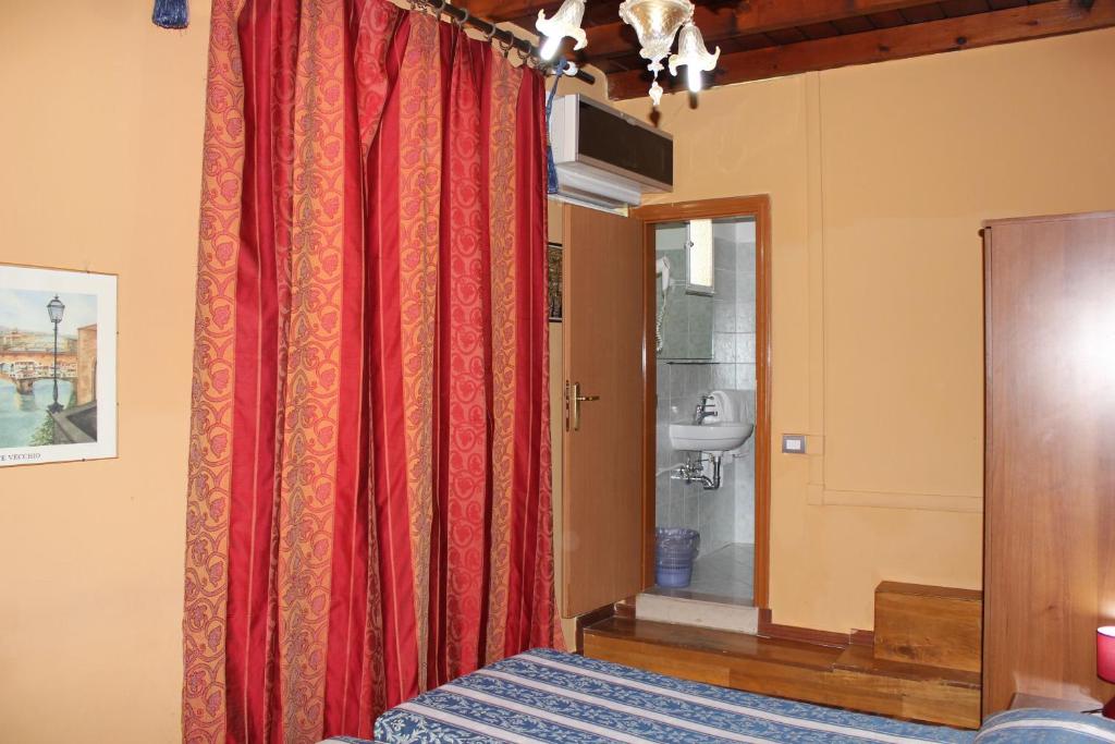 Postel nebo postele na pokoji v ubytování Hotel San Lorenzo