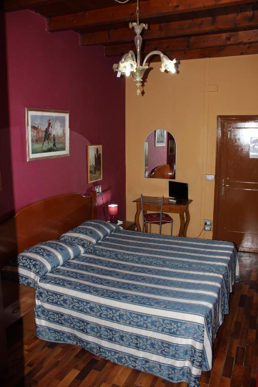 Postel nebo postele na pokoji v ubytování Hotel San Lorenzo