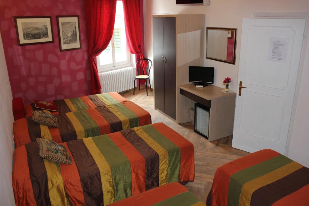 Postel nebo postele na pokoji v ubytování Hotel San Lorenzo