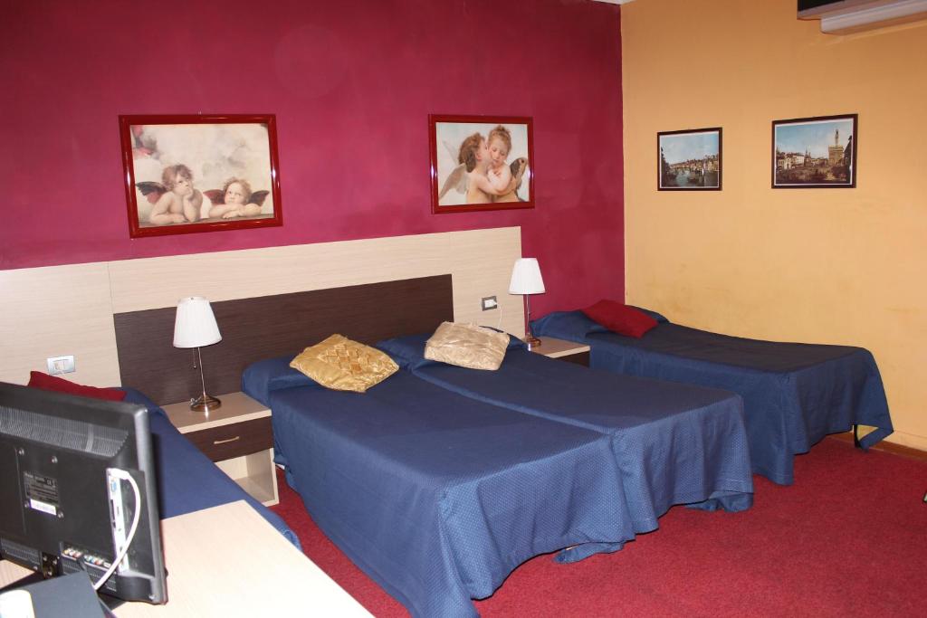 Postel nebo postele na pokoji v ubytování Hotel San Lorenzo