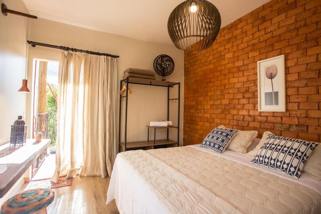 Postel nebo postele na pokoji v ubytování Vilarejo Guesthouse - Silêncio e Aconchego