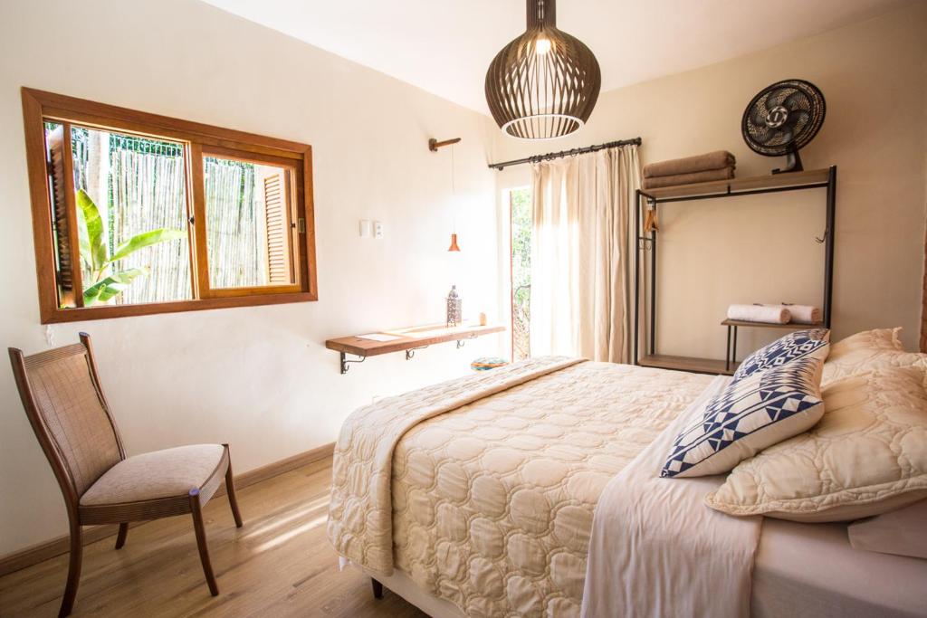 Postel nebo postele na pokoji v ubytování Vilarejo Guesthouse - Silêncio e Aconchego