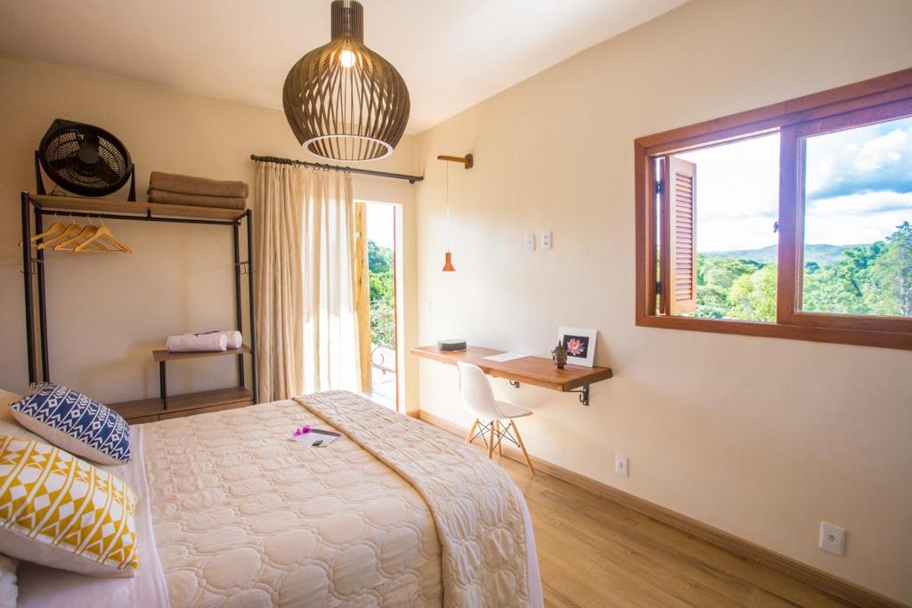 Postel nebo postele na pokoji v ubytování Vilarejo Guesthouse - Silêncio e Aconchego