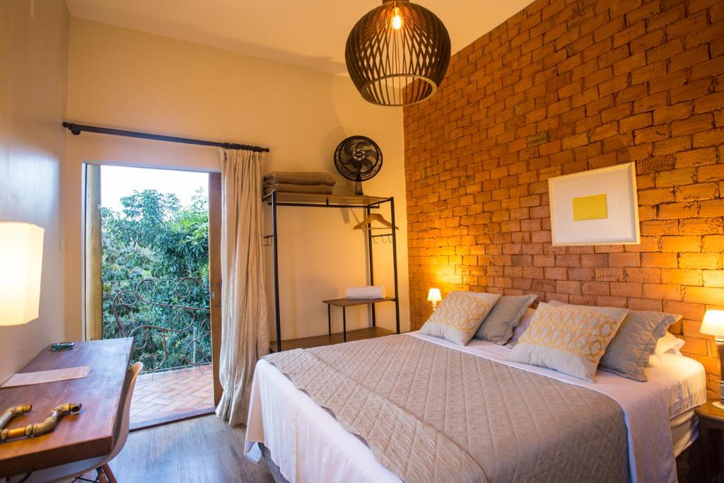 Postel nebo postele na pokoji v ubytování Vilarejo Guesthouse - Silêncio e Aconchego