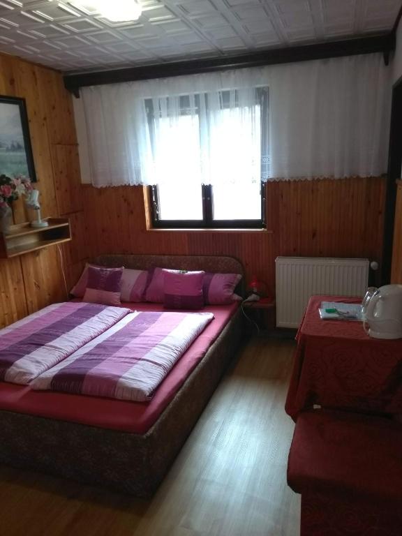 Postel nebo postele na pokoji v ubytování Pension Nika