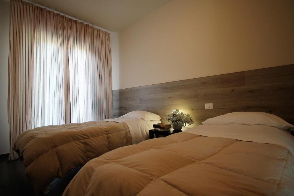 Posteľ alebo postele v izbe v ubytovaní Residence Felice