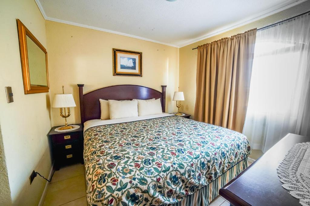Postel nebo postele na pokoji v ubytování Aparthotel Serena Dream