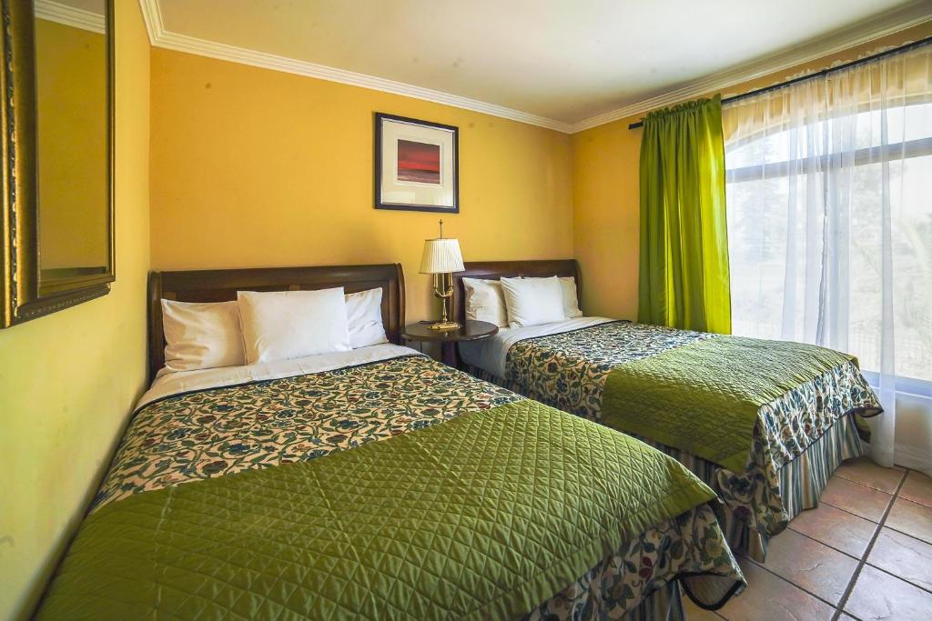 Postel nebo postele na pokoji v ubytování Aparthotel Serena Dream