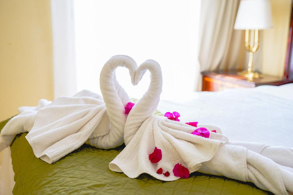 Postel nebo postele na pokoji v ubytování Aparthotel Serena Dream