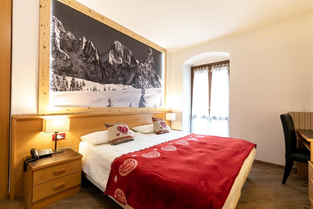 Postel nebo postele na pokoji v ubytování Hotel Isolabella Wellness