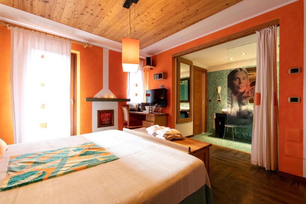 Postel nebo postele na pokoji v ubytování Hotel Isolabella Wellness