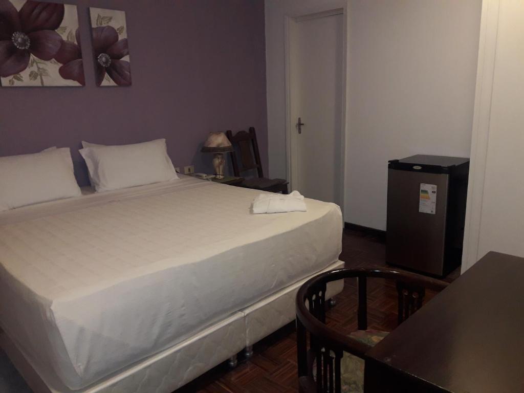 Postel nebo postele na pokoji v ubytování Hotel Casa Jardin